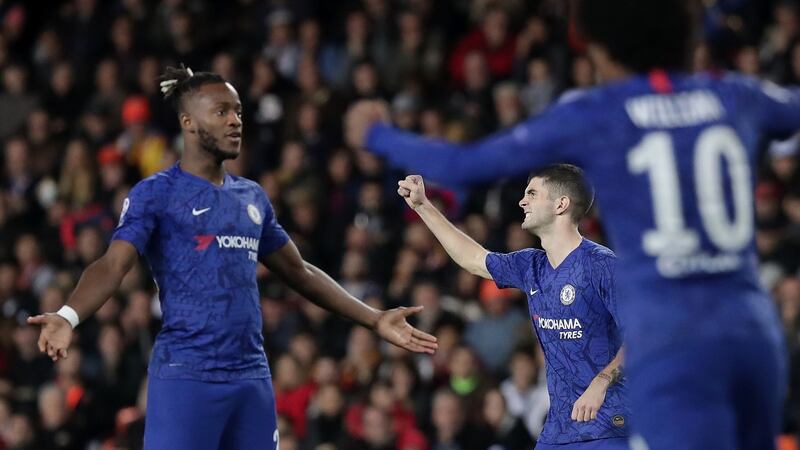 Christian Pulisic of Chelsea celebrates with team-mates Michy Batshuayi and Willian after a VAR review awards the team’s second goal during the  Champions League Group H match against Valencia at the Mestalla  at the  Mestalla. Photograph: Gonzalo Arroyo Moreno/Getty Images