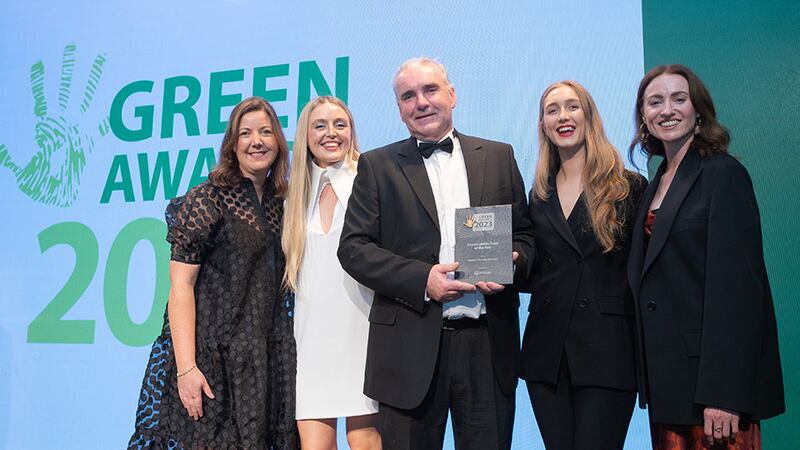 Fergus Elebert, director, Veolia, presents the Sustainability Team of the Year award to the Brown Thomas Arnotts team.