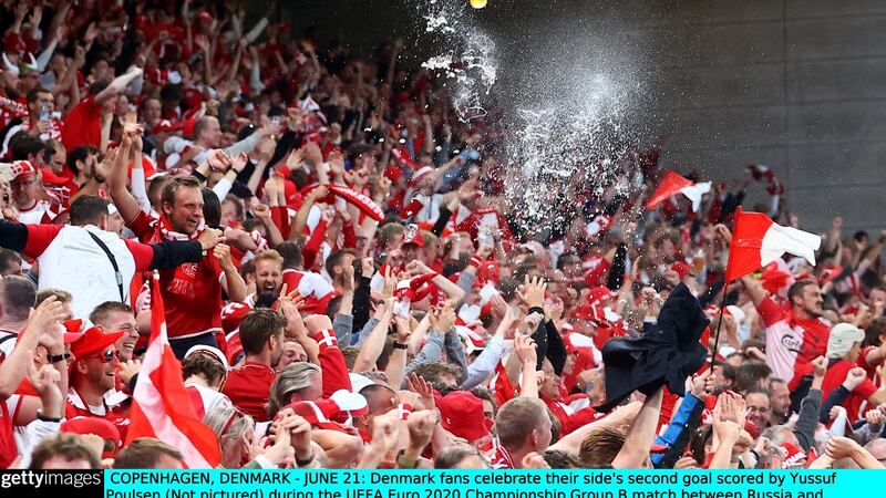 Danish fans celebrate during the game. Photo: Wolfgang Rattay - Pool/Getty Images