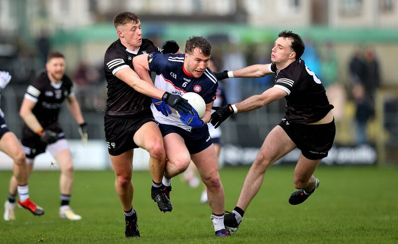 Sligo’s Brian Cox and Cian Lally with Robert Wharton of New York in the Connacht GAA Senior Football Championship semi-final at Markievicz Park last April. File photograph: Inpho