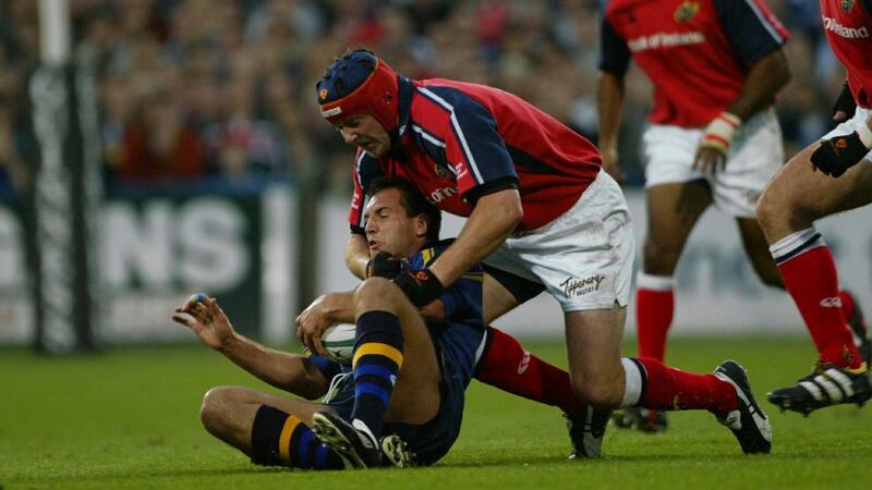 Leinster’s Keith Gleeson  is tackled by Anthony Foley of Munster in 2003. Photograph: Patrick Bolger/Inpho