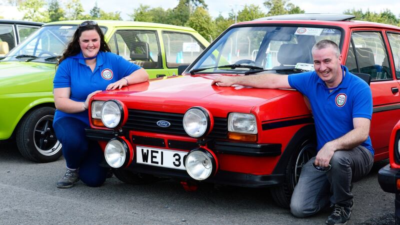 John Egan, of Tuam, Co Galway and girlfriend Ciara Kinsella from Grangecon, Co Wicklow, with his Ford Fiesta (crowned Ireland’s oldest), celebrating 40 years since the model’s launch, at Weston Airport today. Photograph: Cyril Byrne/The Irish Times