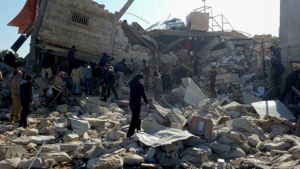 Syrians gather outside a hospital supported by MSF near Maarat al-Numan after the building was hit by suspected Russian air strikes. File photograph: Sam Taylor/AFP/Getty Images