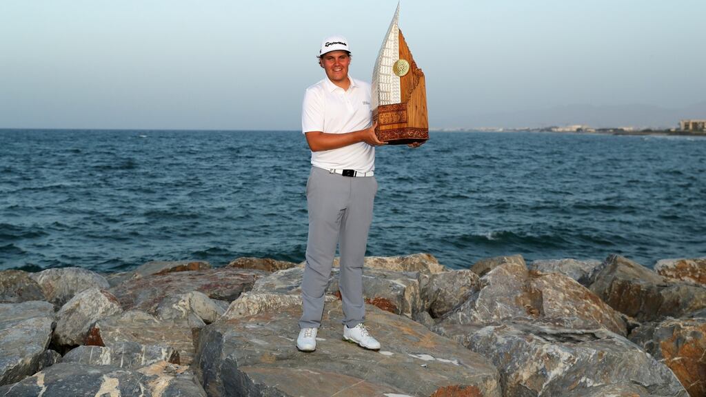 Sami Valimaki of Finland poses with the trophy after winning the Oman Open. Photo: Warren Little/Getty Images