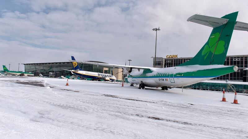 Ryanair and Aer Lingus flights sit on the snow-covered apron at Cork Airport. Photograph: Michael Mac Sweeney/Provision