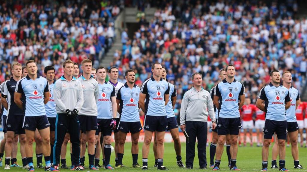 Dublin manager Jim Gavin and the Dublin squad observe the national anthem before the All-Ireland quarter-final against Cork. ‘There’s a great esprit de corps. A great bond. And a great belief’, says Gavin of his squad. Photograph: Cathal Noonan/Inpho
