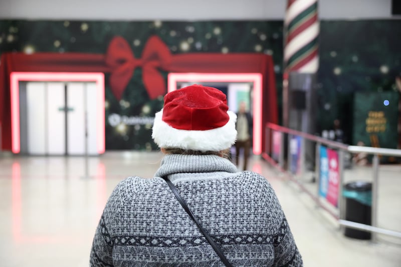 Natalia Price donned a Christmas hat while waiting on her son Timothy to arrive home from Dallas. Photograph: Enda O'Dowd