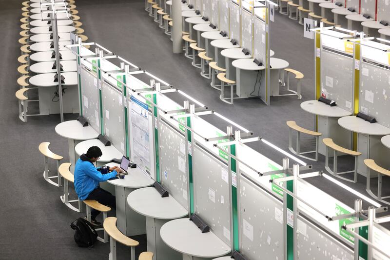 Vedh Kannan, a sixth-year student at Sutton Park School, Sutton, Dublin, sets up his project Metastasis in Silico: Computational Models and Targeted Approaches at the event. Photograph: Dara Mac Dónaill/The Irish Times







