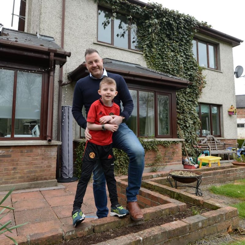 George (7) and Donal Crotty at their home in Ratoath, Co Meath. ‘Owning a house isn’t as much of a thing as it was.’ Photograph: Alan Betson