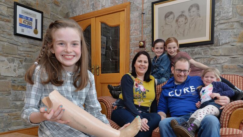 Amy Sheridan (11) who was born without a fibula, the long, thin bone in the lower leg that runs parallel to the tibia,  at home in Dunleer, Co Louth with her mother Caitríona, father Shay and sisters Sally (7), Lucy (9) and Kelly (4). Photograph: Alan Betson