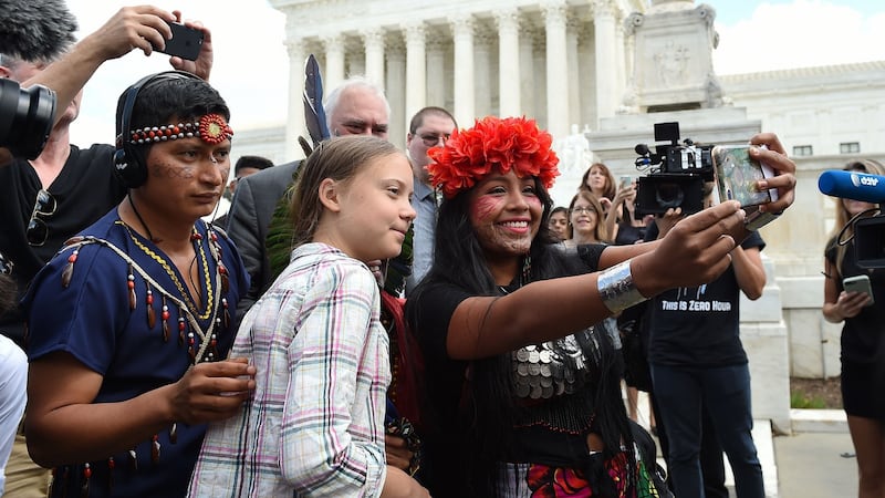 Militza Flaco (right) from the Global Alliance of Territorial Communities Guardians of the Forest takes a selfie with Greta Thunberg in front of the US supreme court. Photograph: Olivier Douliery/AFP/Getty Images