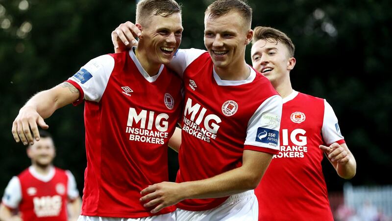 Ian Turner celebrates scoring a goal with his St patrick’s Athletic team-mates  Jamie Lennon and Darragh Markey during the SSE Airtricity League Premier Division match at  Richmond Park. Photograph: Bryan Keane/Inpho