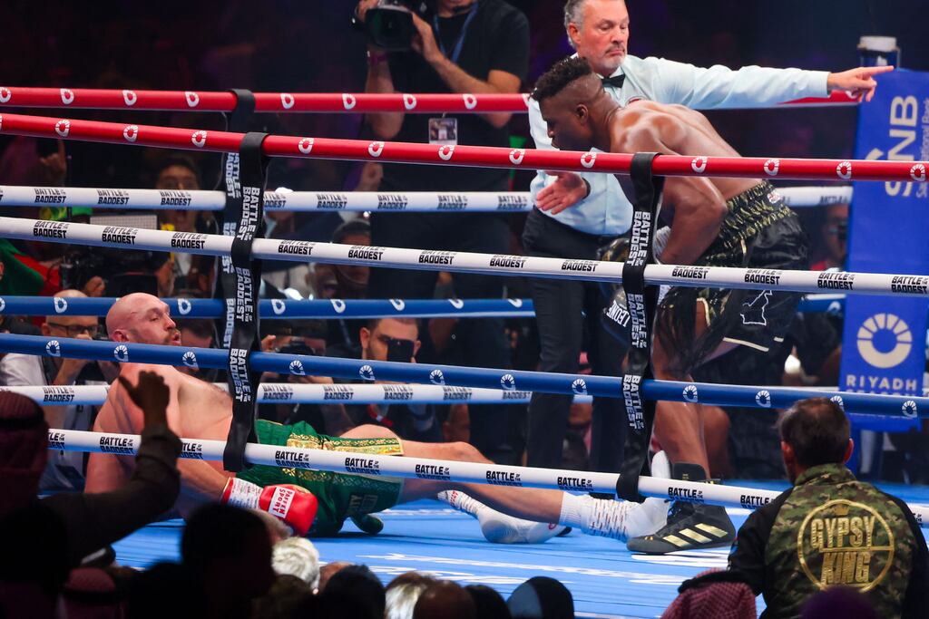 Tyson Fury falls on the ground as he fights against Francis Ngannou during their heavyweight boxing match in Riyadh. Photograph: Fayez Nureldine/AFP via Getty