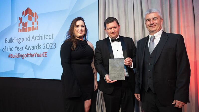 Pat Kirwan, awards judge, presents the building of the year – educational award to Anna Cullen and Barrie Whelan of Henry J Lyons