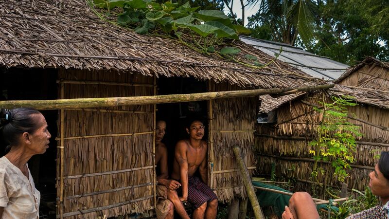 People gather  in the village of Sin Ma Kaw, Myanmar, which has banned Muslims from staying there. Photograph: Adam Dean/The New York Times