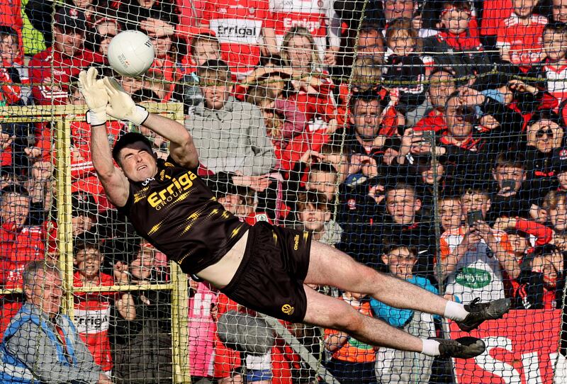 Derry goalkeeper Odhrán Lynch saves Ethan Rafferty’s penalty during the Ulster SFC Final in Clones. Photograph: Tom Maher/Inpho