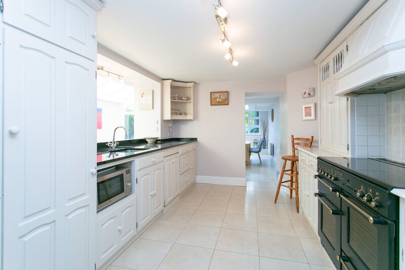 Kitchen opening into dining room.
