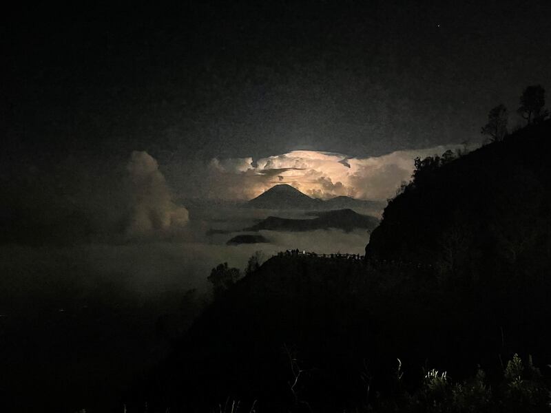 Lighting flares behind Mount Bromo shortly before sunrise. Photograph: Glen Murphy