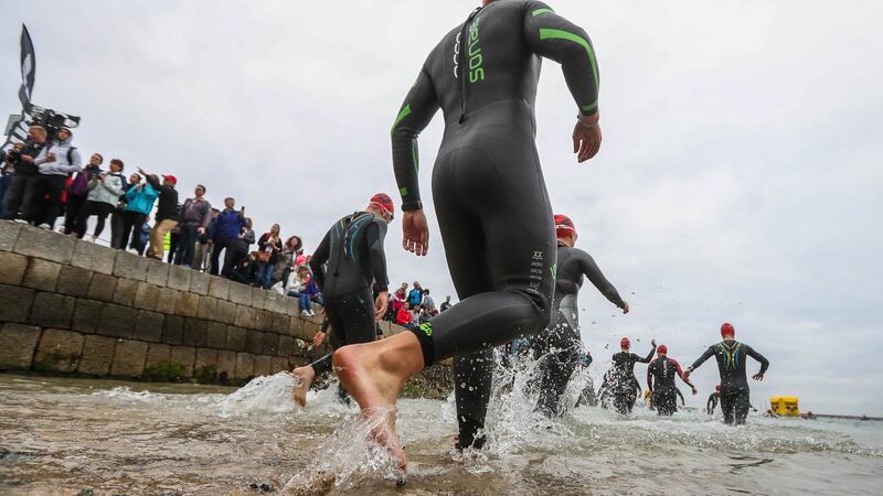 Ironman competitors enter the sea at Dun Laoghaire. Photograph: Ryan Byrne/Inpho
