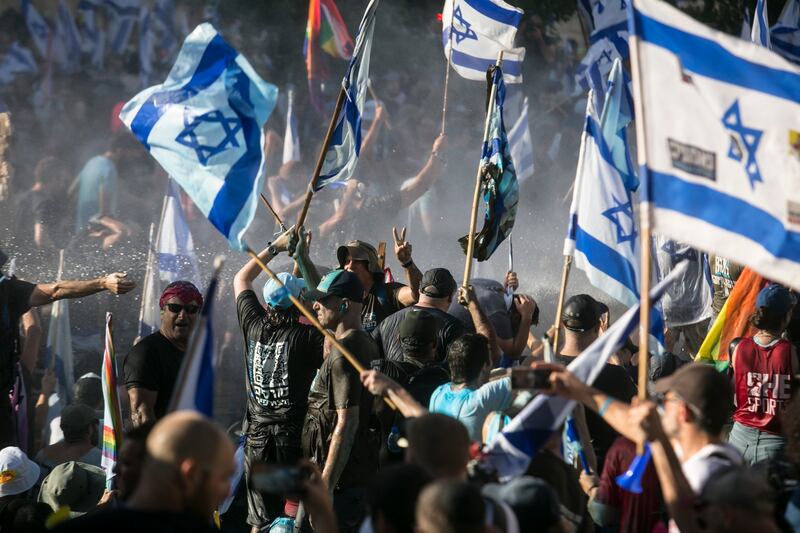 Police officers use water cannons to force protesters from a main road in Jerusalem. Some 20, 000 anti-government protesters marched from Tel Aviv in opposition to the government's plans to restrain the judiciary. Photograph: Amir Levy/Getty Images
