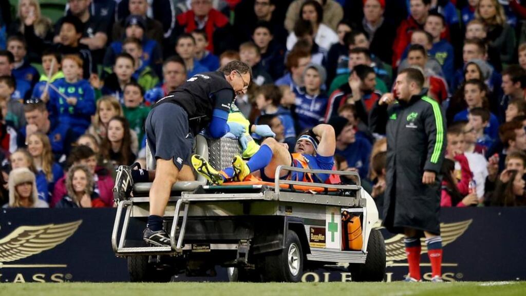 Fergus McFadden leaves the field on a stretcher after injuring his ankle in the Guinness Pro12 game against Munster at the Aviva Stadium. Photograph: James Crombie/Inpho