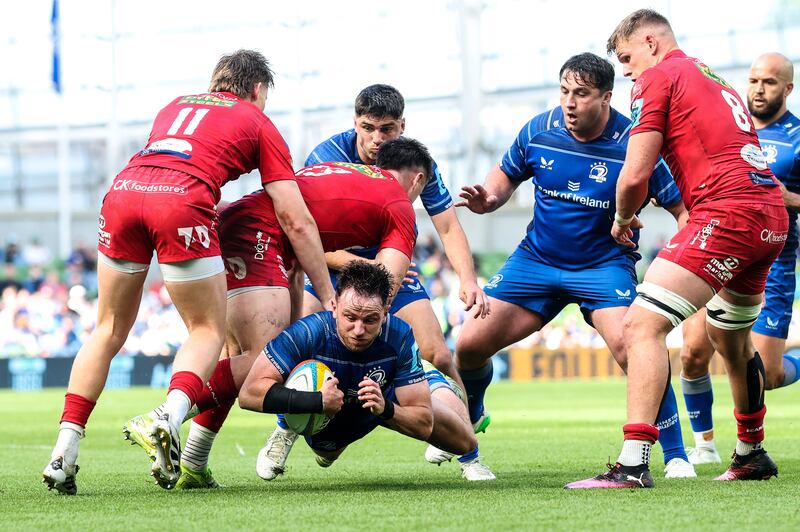 Hugo Keenan scores a try for Leinster during their URC quarter-final win against Scarlets. Photograph: Billy Stickland/Inpho