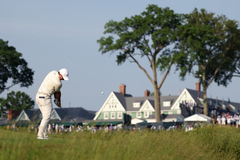 Rory McIlroy of Northern Ireland plays a shot on the 11th hole. Photograph: Andy Lyons/Getty