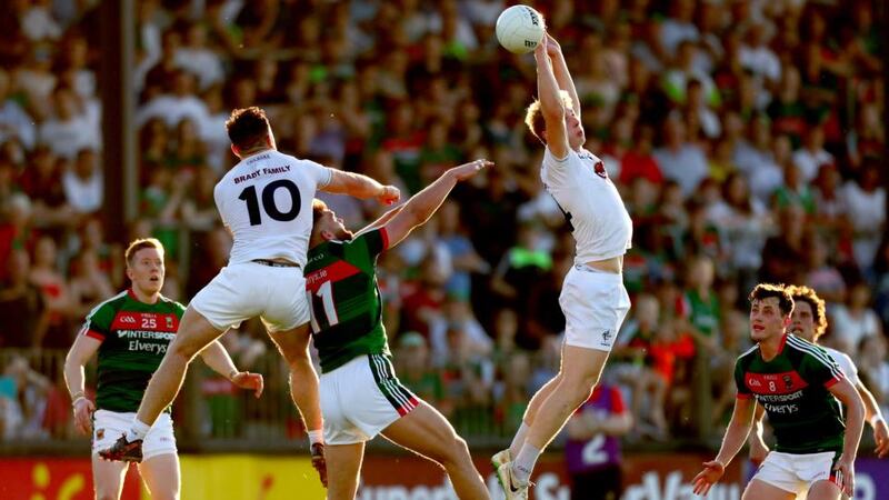 Kildare’s Fergal Conway and Daniel Flynn in action with Aidan O’Shea of Mayo during the  All-Ireland SFC Round 3 qualifier  at St Conleth’s Park in Newbridge. Photograph:  James Crombie/Inpho