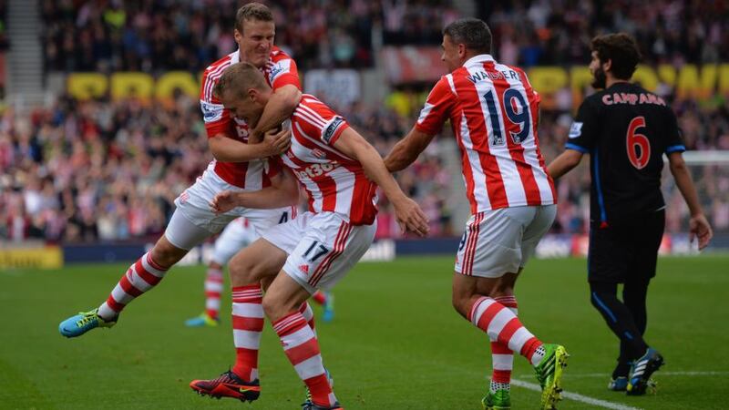 Ryan Shawcross of Stoke (centre) celebrates scoring with Robert Huth (left) and Jonathan Walters at Britannia Stadium. Photograph: Christopher Lee/Getty Images