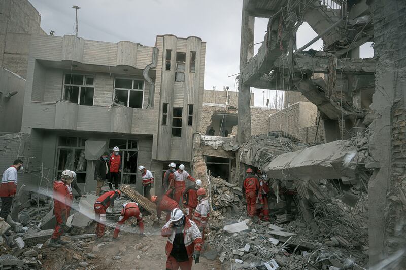 Rescue workers at a residential building hit in an overnight strike in Tabriz, Iran. Photograph: Matin Hashemi/AP