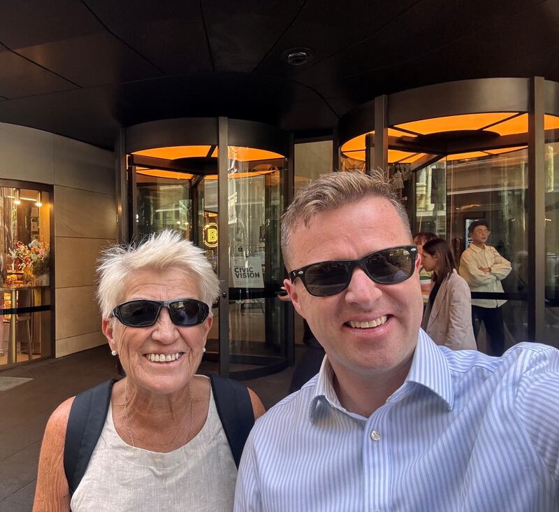 Cormac McConville with his mother Mary outside his office building in Sydney