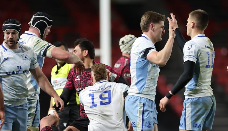 Leinster’s Jordie Barrett celebrates a turnover with Sam Prendergast. Photograph: James Crombie/Inpho