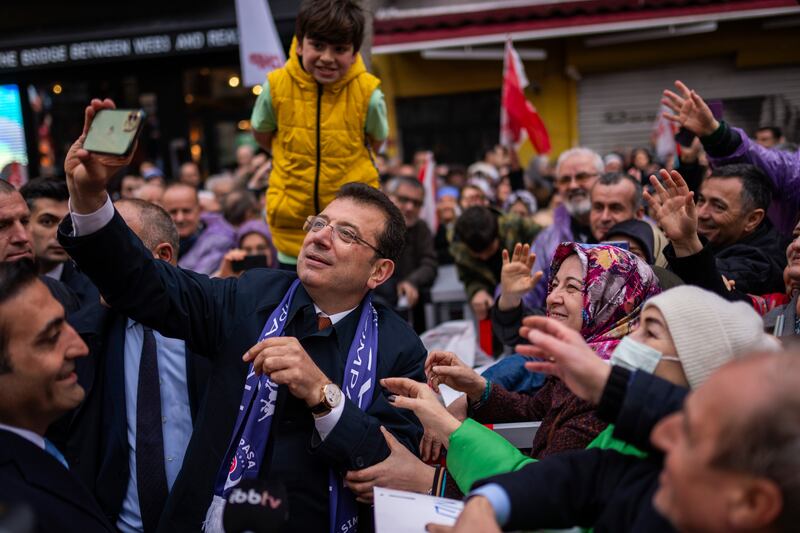Istanbul mayor Ekrem Imamoglu takes photographs with supporters. Photograph: Francisco Seco/AP
