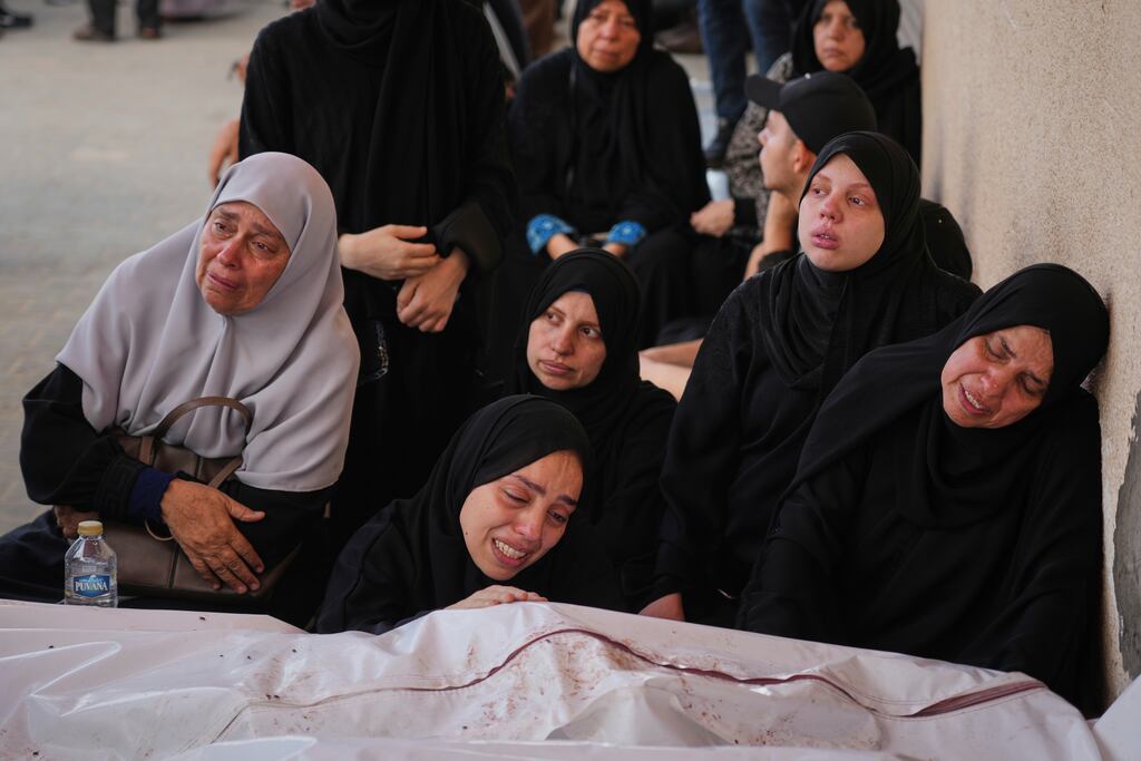 Mourners attend the funeral of their relatives who were killed in an Israeli bombardment, in Deir al-Balah, Gaza Strip, on Saturday. Photograph: Abdel Kareem Hana/AP