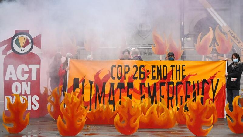 Activists  welcome world leaders to Cop26 with a field of climate fire in George Square  in Glasgow, Scotland. Photograph: Jeff J Mitchell/ Getty