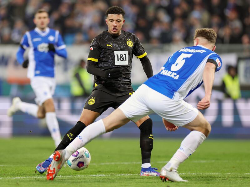 Dortmund's Jadon Sancho in action against SV Darmstadt's Matej Maglica  during the Bundesliga clash in Darmstadt, Germany.