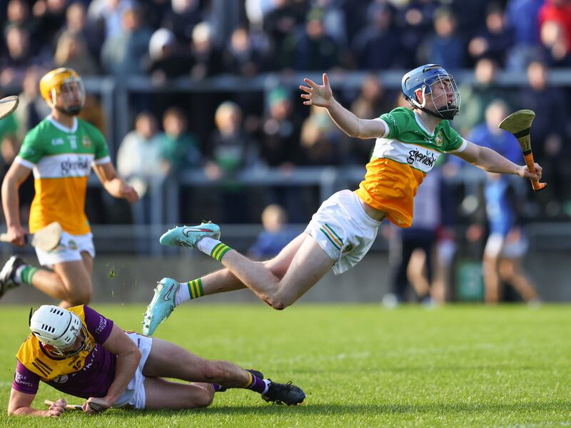 Offaly's Shane Rigney takes a tumble after a challenge from Wexford's Niall Murphy during the game in Tullamore. Photograph: Tom O’Hanlon/Inpho