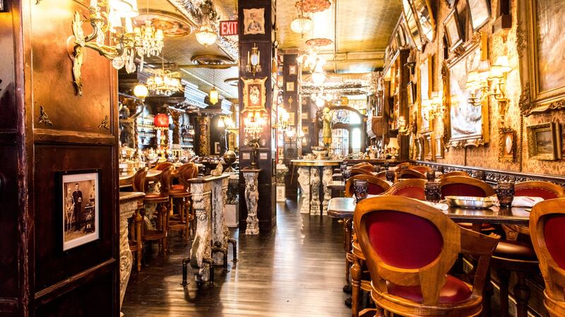 The decadent interior features wood panels from Hope Castle in Castleblayney, gilt-framed mirrors, pieces of imported Murano glass and eccentric antiques from Ireland, France, England, Scotland, and Wales