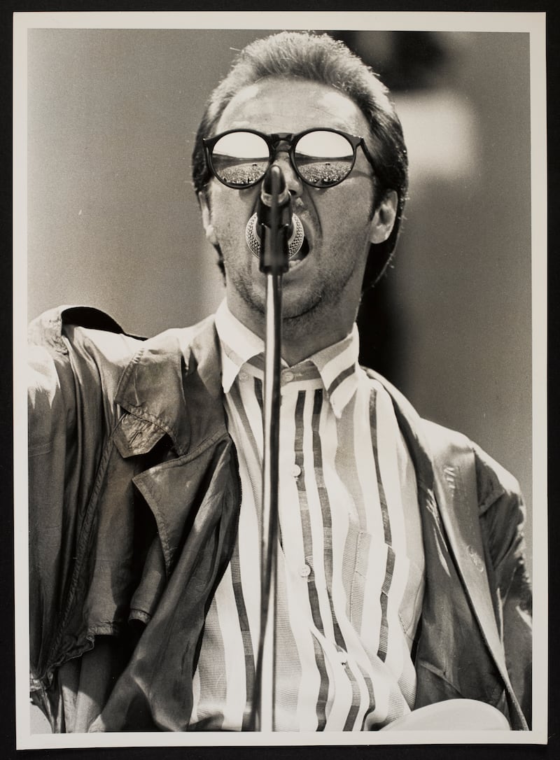 Close up of Midge Ure (Ultravox) on stage at Wembley, with reflection of audience in sunglasses

Photographer credit: Jeremy Mitchell:  Band Aid Archive courtesy © The National Library of Ireland.