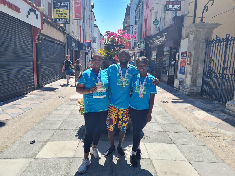 Sanctuary runners at Cork City Marathon: Thembi Tshuma, Noel Addablah and Sikyhanyiso Mpofu. Photograph: Barry Roche