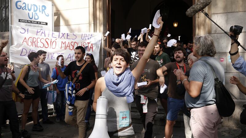 Students shout slogans and wave Catalan referendum voting cards during a demonstration called for by the Catalan National Assembly  and Omnium Cultural outside the University of Barcelona. Photograph: Pau Barrena/Bloomberg