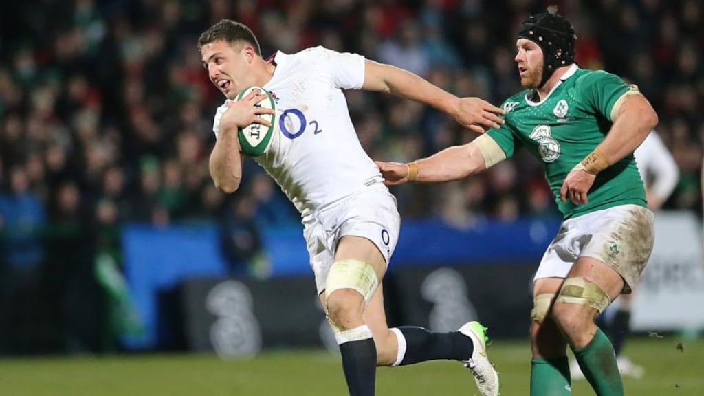Ireland Wolfhounds’ Seán O’Brien gets to grips with England Wolfhounds’ Sam Burgess during the game at Musgrave Park. Photograph:  Niall Carson/PA