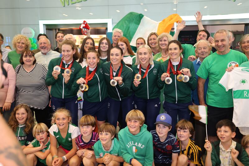 Team Ireland Paralympic medal winners Róisín Ní Riain, (swimming), Linda Kelly (cycling), Eve McCrystal (cycling),  Orla Comerford (sprint) and Katie-George Dunlevy (cycling), arrive home at Dublin Airport.
Photograph: Dara Mac Dónaill/The Irish Times











