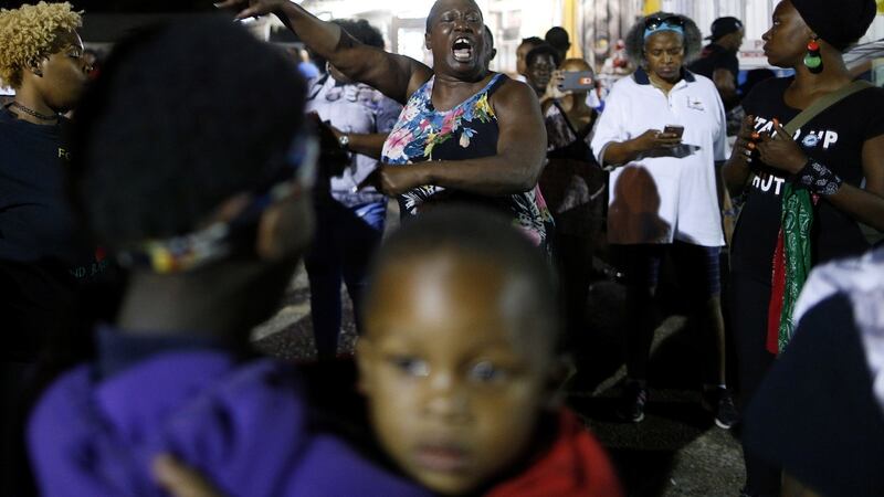 Alton Sterling’s aunt Veda Washington-Abusaleh speaks to community members during a vigil at the Triple S Food Mart in Baton Rouge on Tuesday. Photograph:  Jonathan Bachman/Reuters
