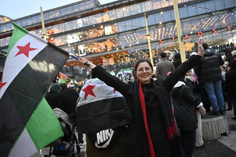 Members of the Syrian community celebrate in Stockholm after the fall of the Assad regime. Photograph: Jonas Ekstromer/TT news agency/AFP via Getty Images