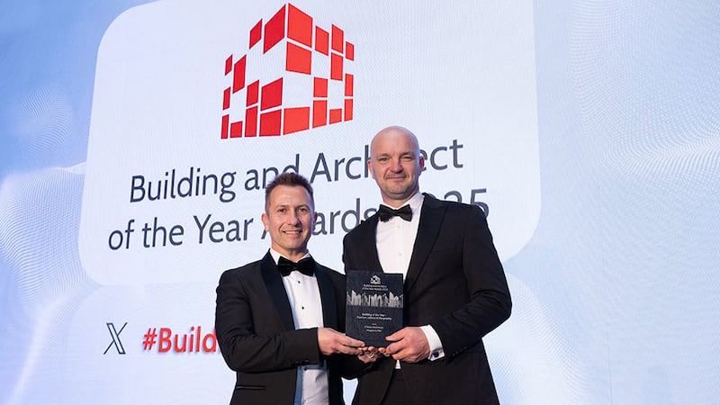 Stephen Pierce, Vescom's irish agent, presents the building of the year - tourism, leisure & hospitality award to Andrew O'Brien, O'Brien Architects