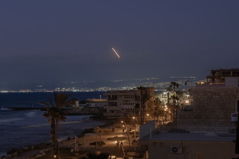 A rocket streaks through the sky over Nahariya, in northern Israel, seen from the city of Haifa, Israel, in mid-March. Photograph: Amit Elkayam/The New York Times