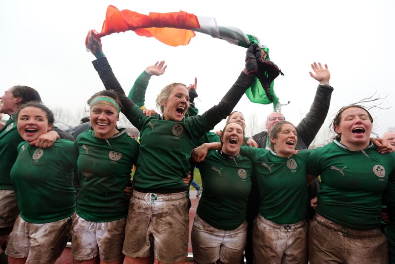 Ireland celebrate completing the Grand Slam after a hard-earned 6-3 win over outsiders Italy in perishing conditions in Parabiago, Milan. Photograph: Dan Sheridan/Inpho 
