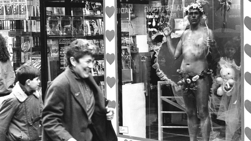 Thom McGinty aka the Diceman dressed as Cupid in a newsagent’s shop in Grafton Street, Dublin, in February 1991. Photograph: Frank Miller