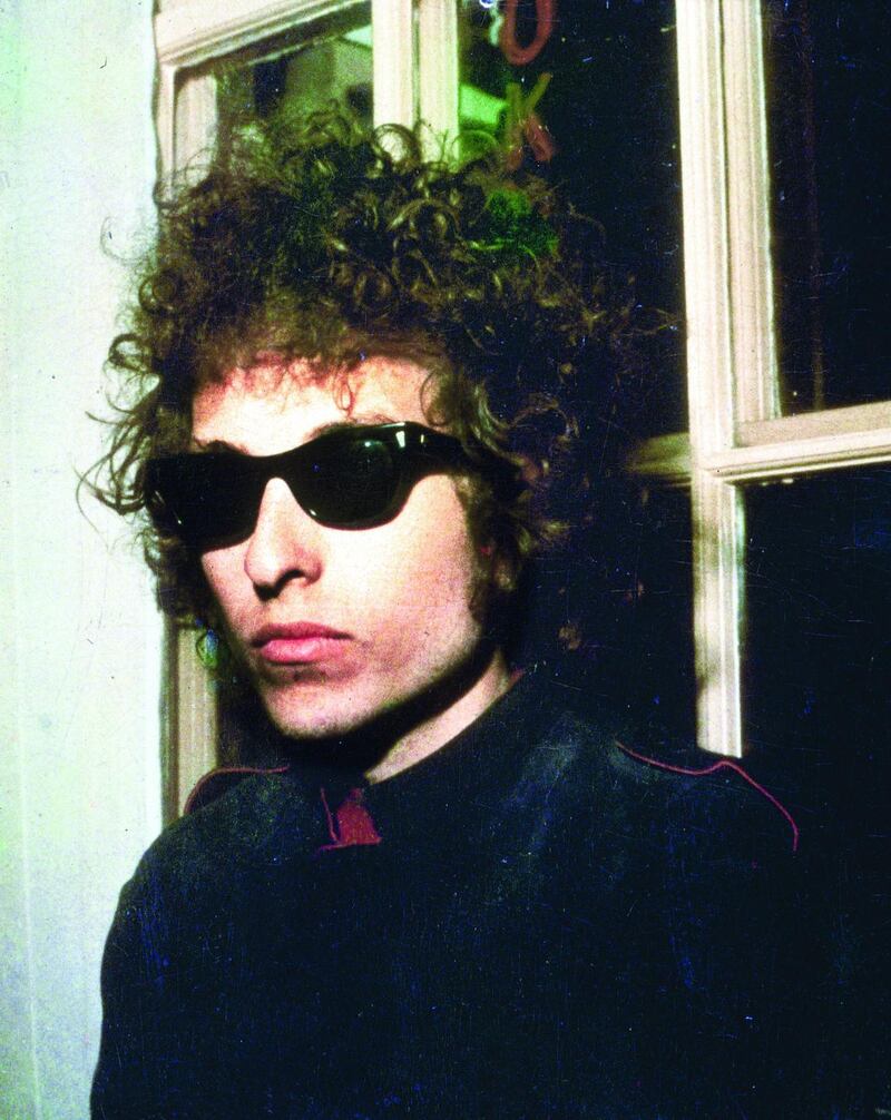 1966:  A headshot of American singer Bob Dylan wearing sunglasses, London, England.  (Photo by Blank Archives/Getty Images)
